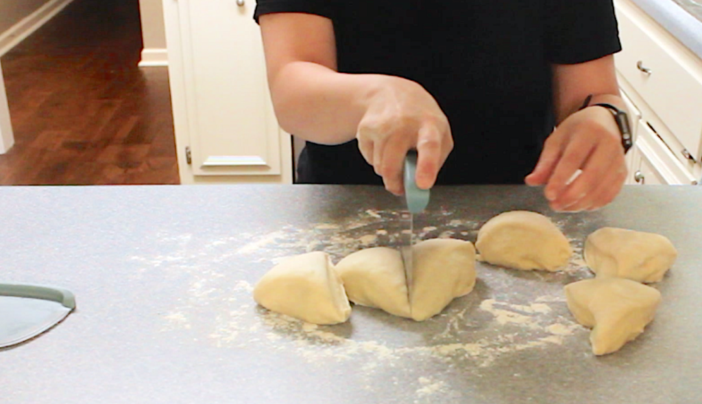 using dough cutter to divide dough