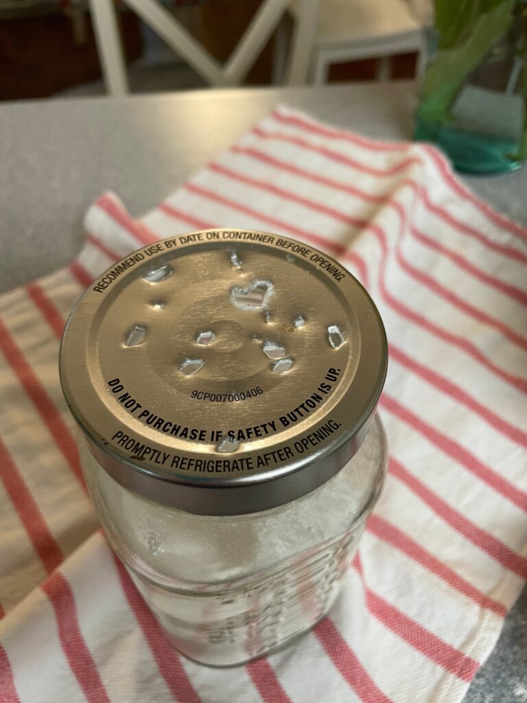 holes poked in lid of jar
