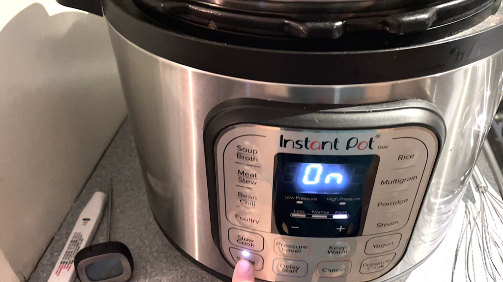 finger pressing saute function on instant pot