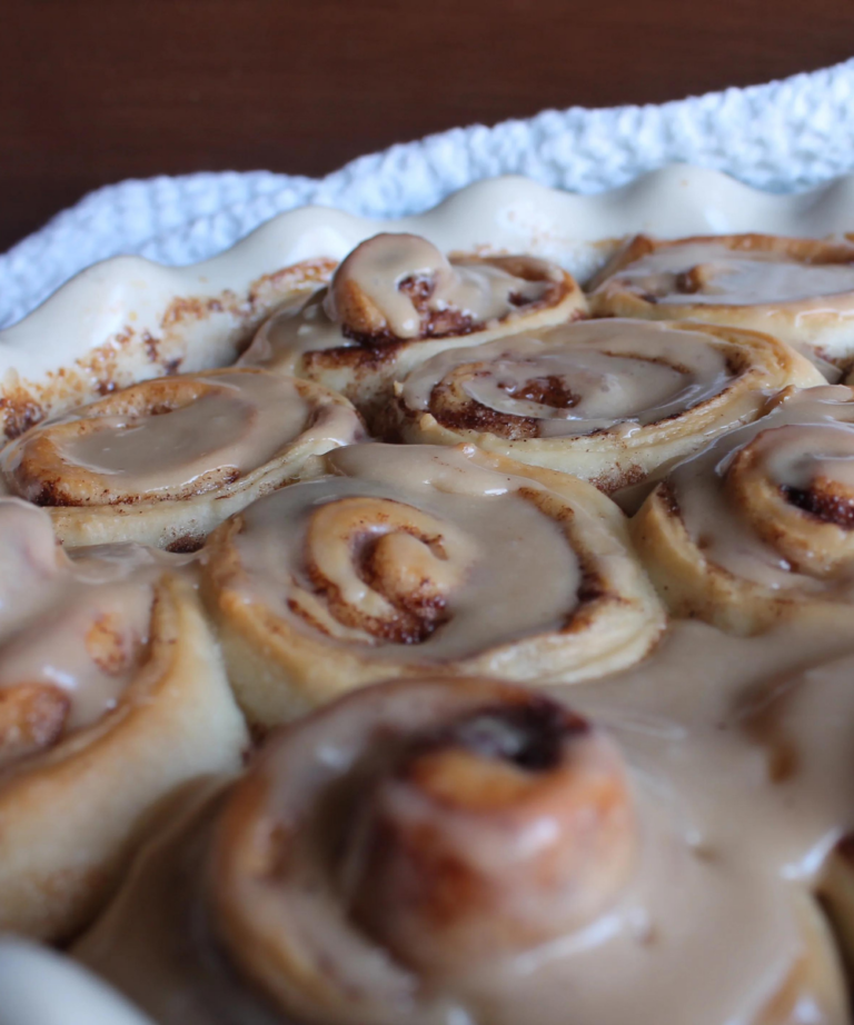 cinnamon rolls with icing up close