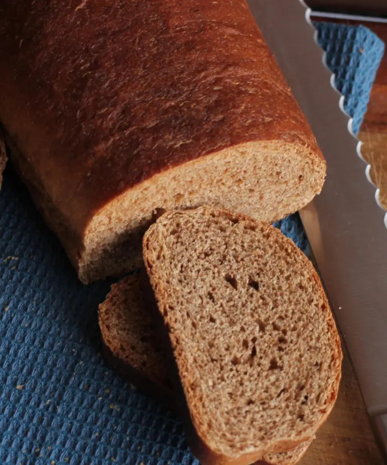 brown bread sliced with bread knife