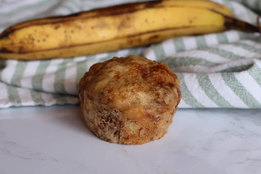 one unwrapped baked banana nut muffin