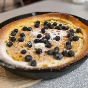 finished dutch baby with blueberries