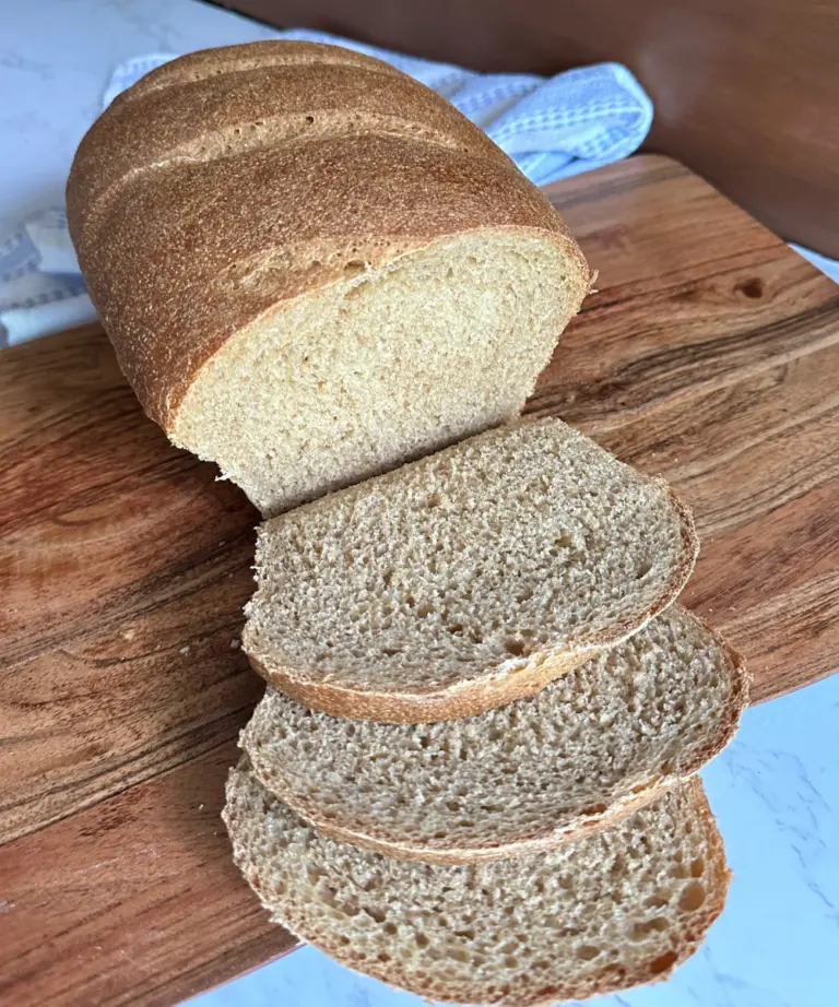 Potato flake sourdough rye bread sliced on cutting board