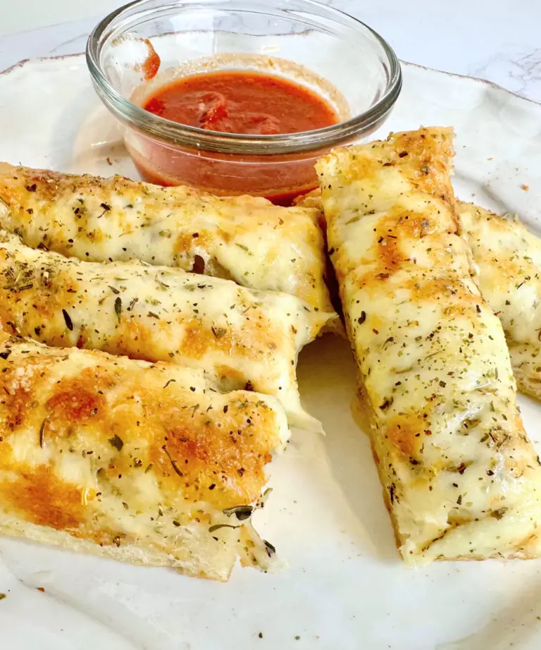 sourdough cheese bread sticks cut with pizza sauce