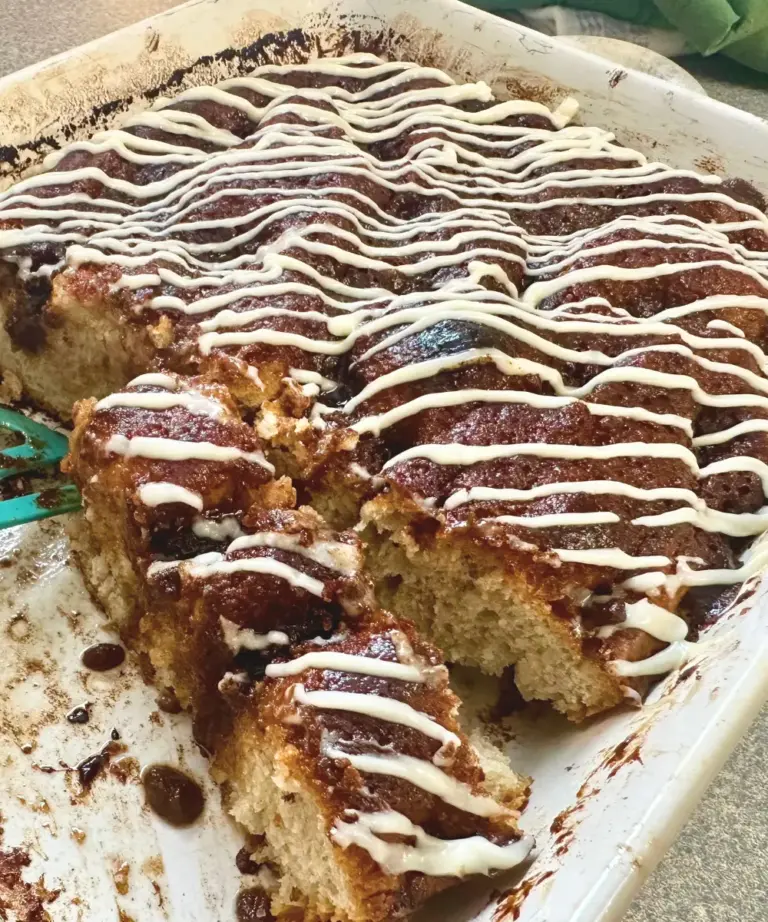 potato flake sourdough cinnamon roll focaccia cut and preparing to serve
