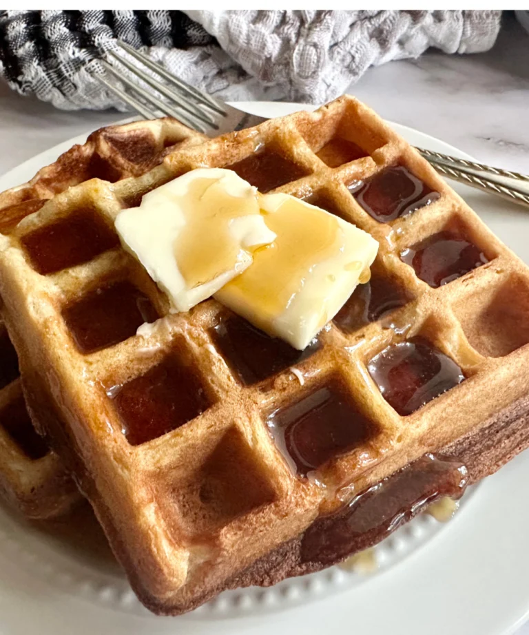 potato flake sourdough waffles with butter pads on top