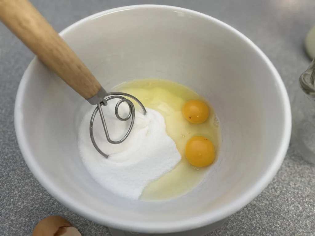 mixing eggs and sugar 
