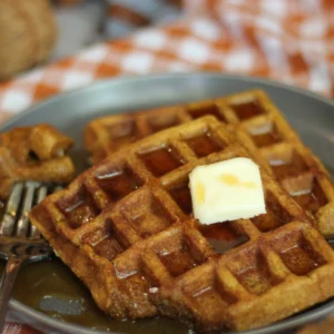 potato flake sourdough pumpkin waffles with butter and syrup