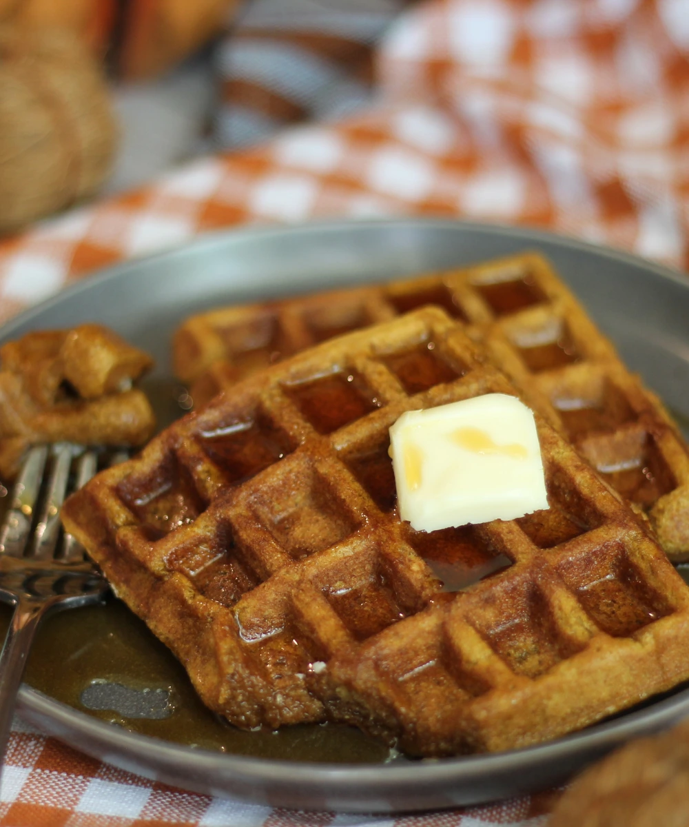 potato flake sourdough pumpkin waffles with butter and syrup