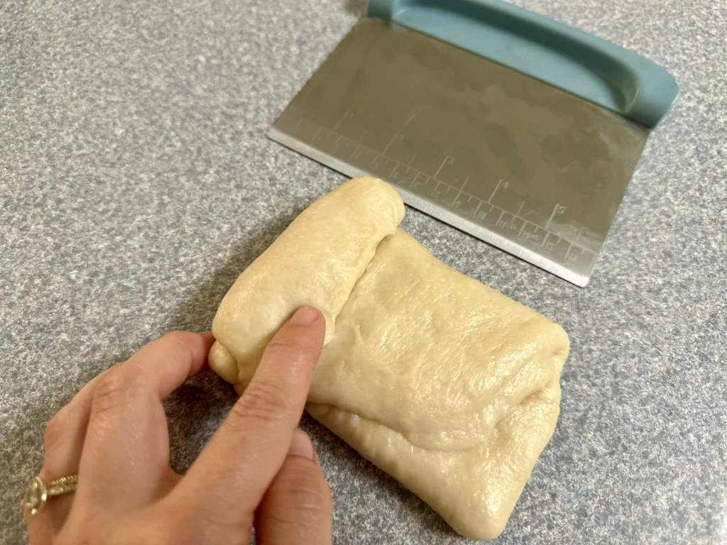 rolling potato flake sourdough milk bread dough